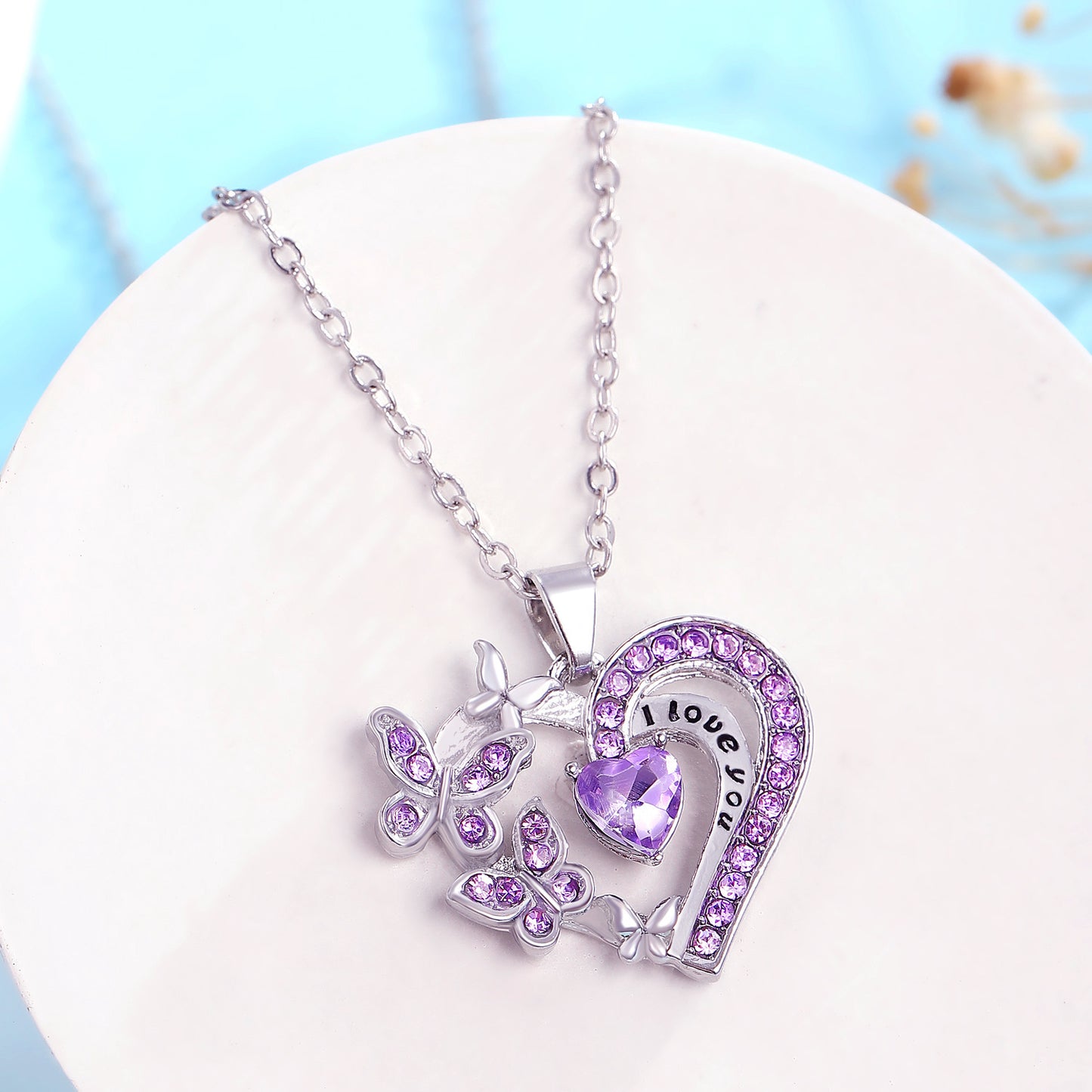 Collana con farfalla e cuore, in strass