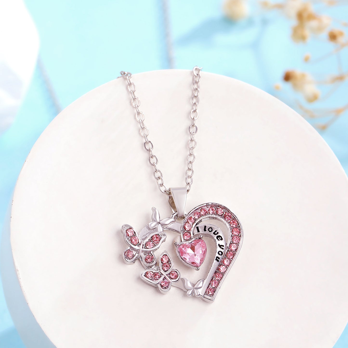 Collana con farfalla e cuore, in strass